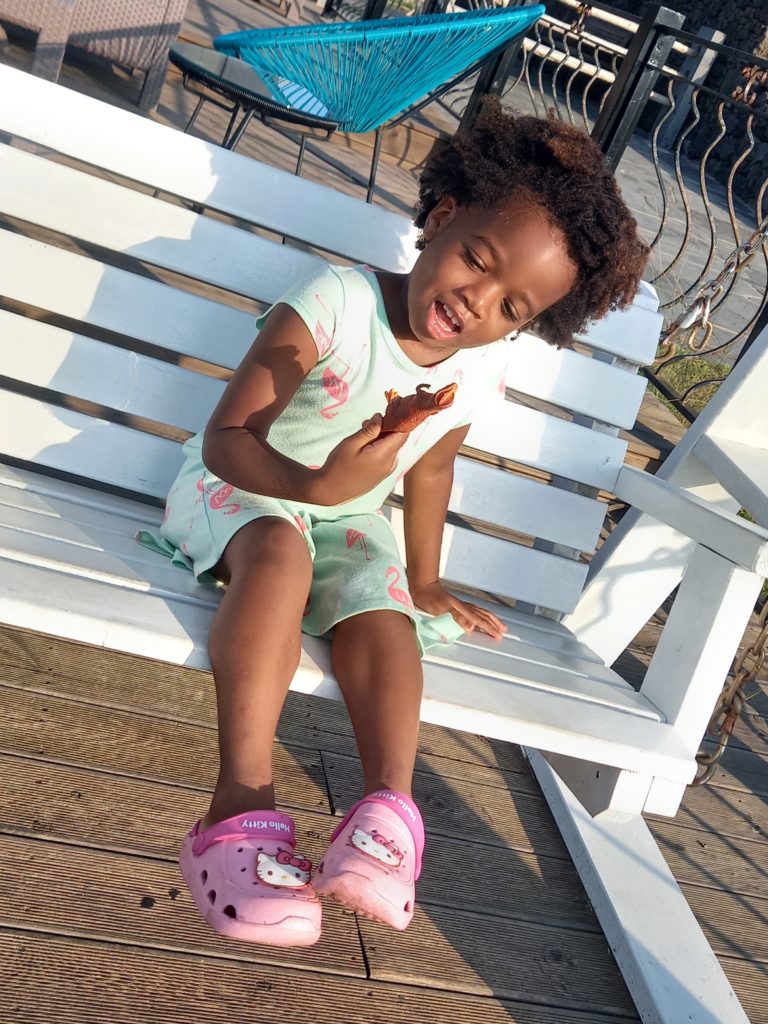 Quadrillionaire Baby Keilah on her swing bench at the Trott Bailey Family private island summer home