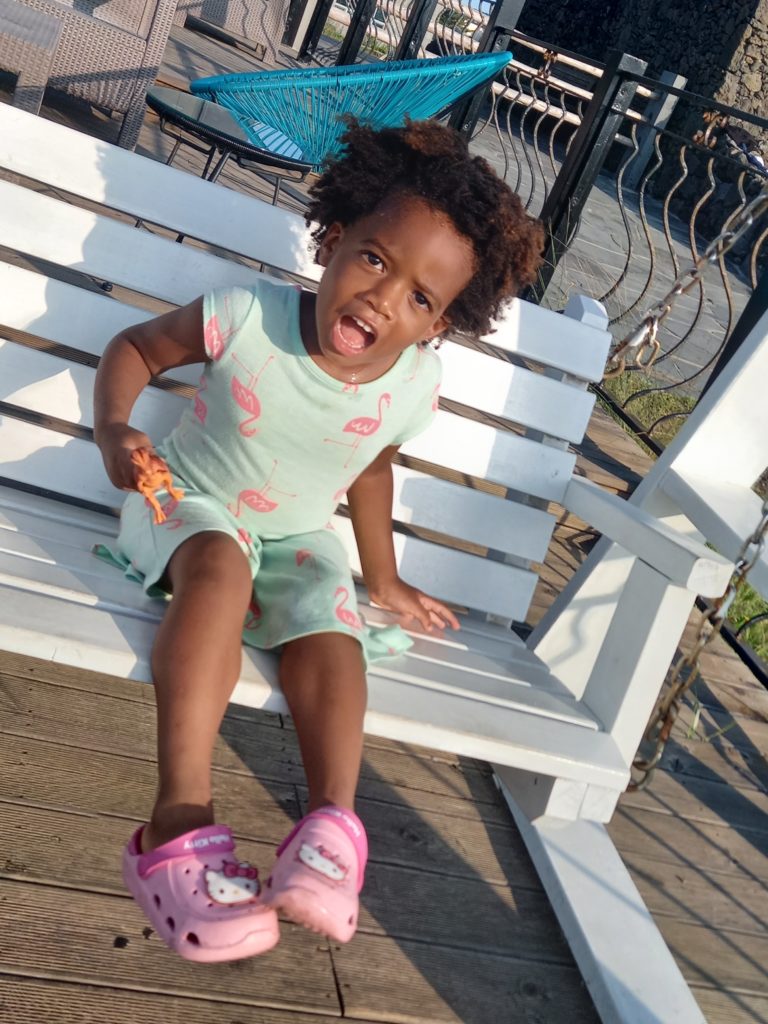 Quadrillionaire Baby Keilah on her swing bench at the Trott Bailey Family private island summer home