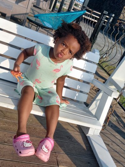 Quadrillionaire Baby Keilah on her swing bench at the Trott Bailey Family private island summer home blowing kisses