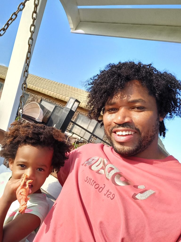 World's first quadrillionaire Kimroy KB Bailey and his baby Keilah Trott Bailey on their Swing Bench.