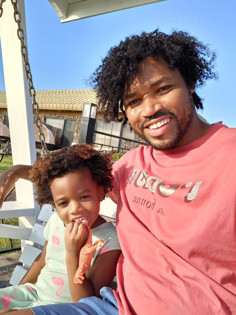 World's first quadrillionaire Kimroy KB Bailey and his baby Keilah Trott Bailey on their Swing Bench. Say cheeze