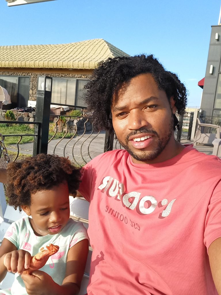 World's first quadrillionaire Kimroy KB Bailey and his baby Keilah Trott Bailey on their Swing Bench.