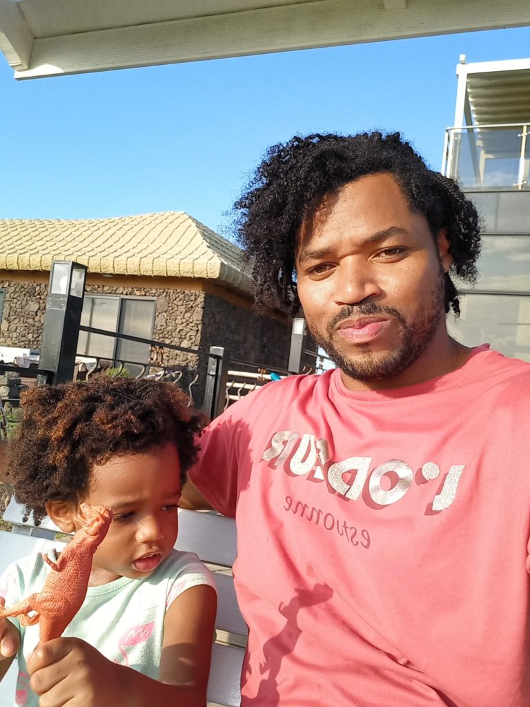 World's first quadrillionaire Kimroy KB Bailey and his baby Keilah Trott Bailey on their Swing Bench.