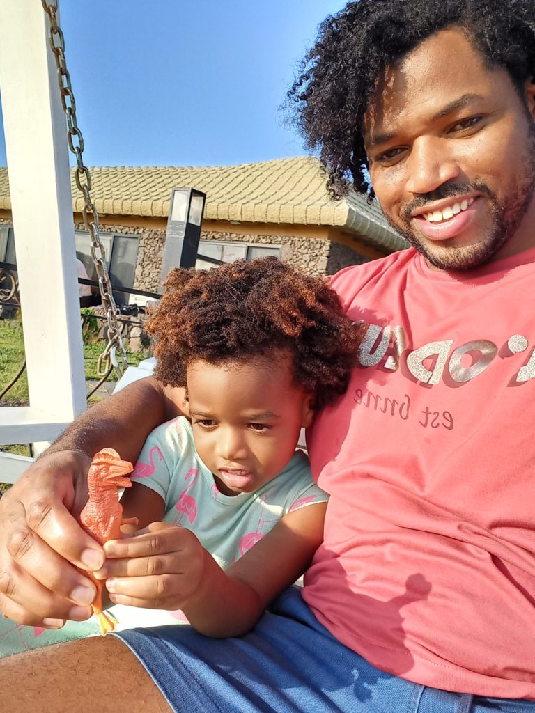 World's first quadrillionaire Kimroy KB Bailey and his baby Keilah Trott Bailey on their Swing Bench.