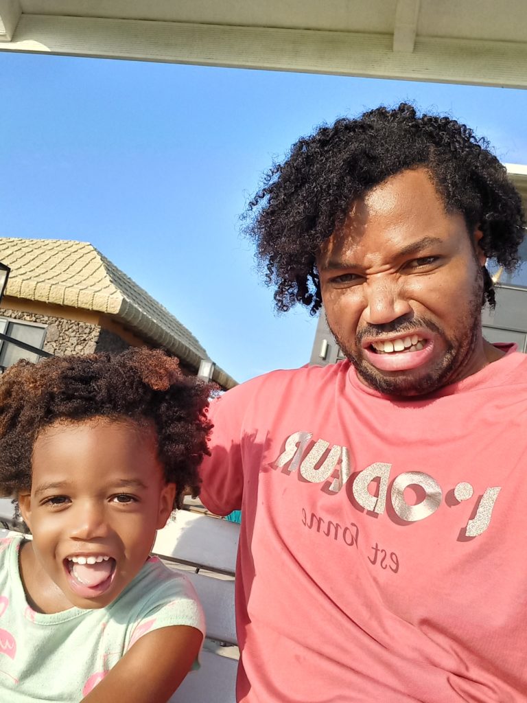 World's first quadrillionaire Kimroy KB Bailey and his baby Keilah Trott Bailey on their Swing Bench. Making a Sad face