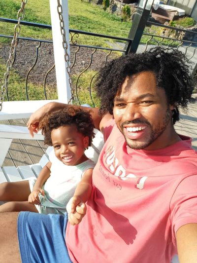 World's first quadrillionaire Kimroy KB Bailey and his baby Keilah Trott Bailey on their Swing Bench. Bap bap