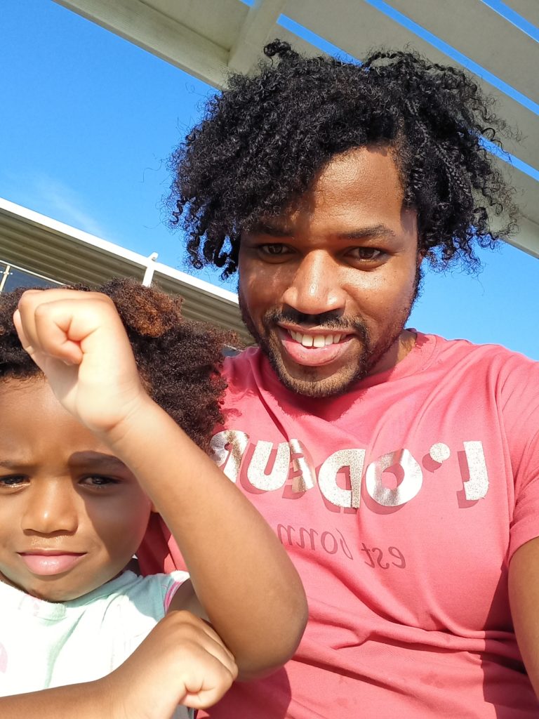 World's first quadrillionaire Kimroy KB Bailey and his baby Keilah Trott Bailey on their Swing Bench.