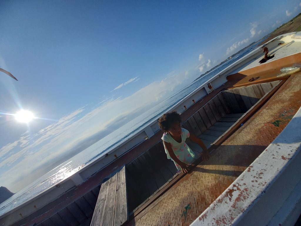 World's first quadrillionaire Kimroy KB Bailey and his baby Keilah Trott Bailey on their Fishing Boat.