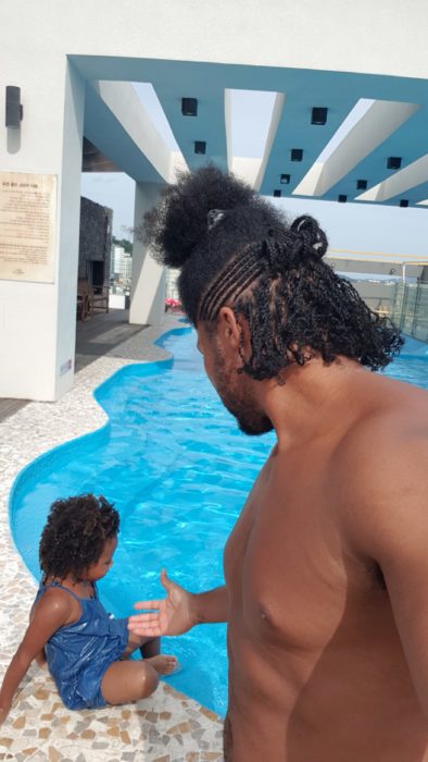 Quadrillionaire Kimroy KB Bailey showcases his new hairstyle at the poolside with Keilah Trott Bailey