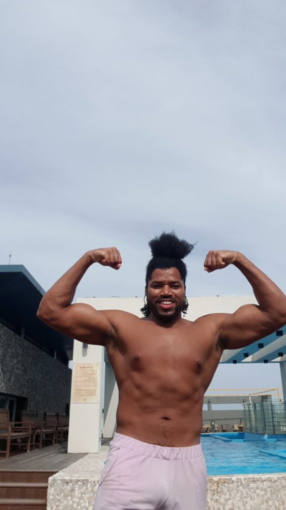 Quadrillionaire Kimroy KB Bailey showcases his new hairstyle and muscles at the poolside with Keilah Trott Bailey