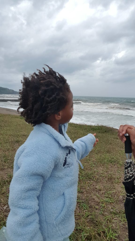 Quadrillionaire Kimroy KB Bailey showcases his new hairstyle at the seaside with Keilah Trott Bailey