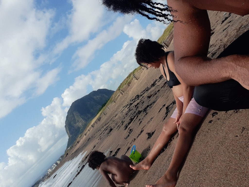 Quadrillionaire Trott Bailey Family chilling at the beach. Buff Bodybuilder Kimroy KB Bailey, Food lover Sher Trott Bailey and Princess Keilah Trott Bailey