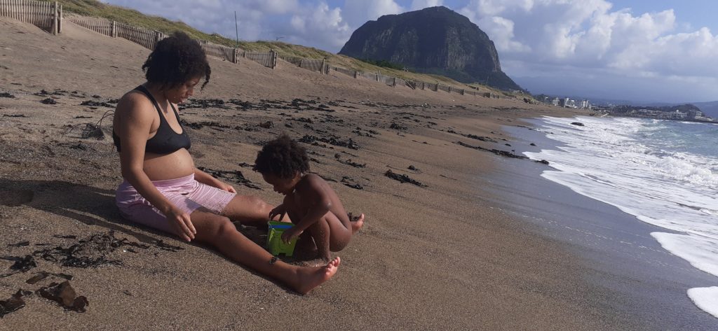 Quadrillionaire Trott Bailey Family chilling at the beach. Buff Bodybuilder Kimroy KB Bailey, Food lover Sher Trott Bailey and Princess Keilah Trott Bailey