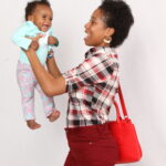About eight months after having her first baby.Sherika Trott Bailey with Keilah excellent physique return to form after delivery. She can be seen here holding Country Ruler Keilah Trott Bailey. This photo was taken in America where the family lived to World School Keilah.