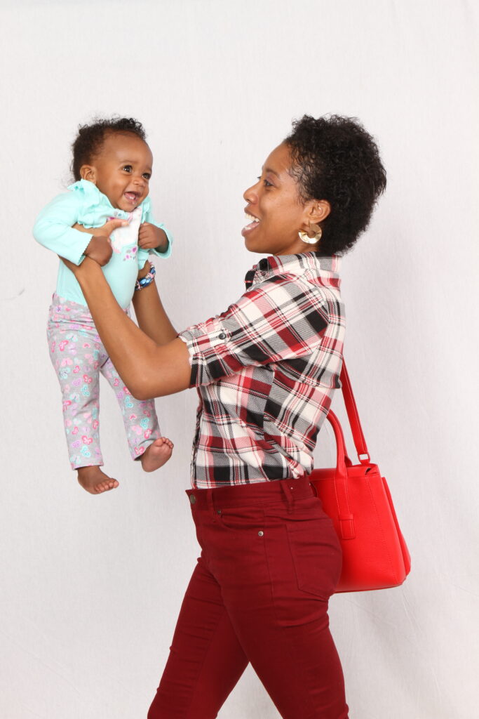 About four months after having her first baby. Sher Trott Bailey excellent physique return to form. She can be seen here holding Country Ruler Keilah Trott Bailey. This photo was taken in America where the family lived to World School Keilah. 