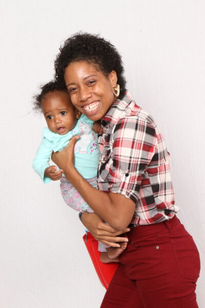 World Ruler Sherika Trott Bailey with Keilah Trott Bailey in America where the Trott Bailey Family lived while world schooling Keilah. She was about 8 months old in this photo smiling with her healthy body mommy.