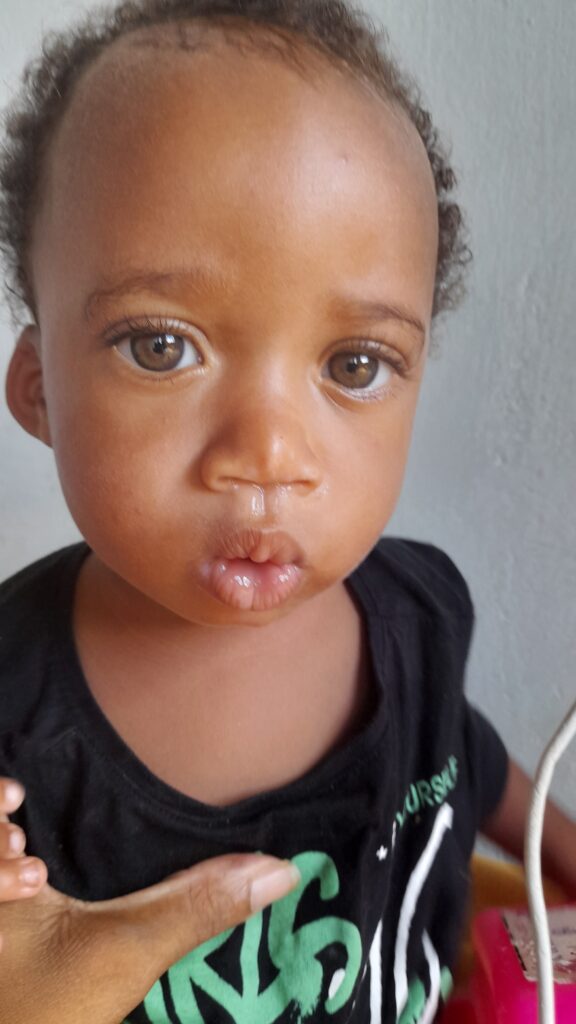 Kezi today extra tender, extra clingy most remarkable eyes, deep navy blue in the center, green-yellow and rimed with platinum.