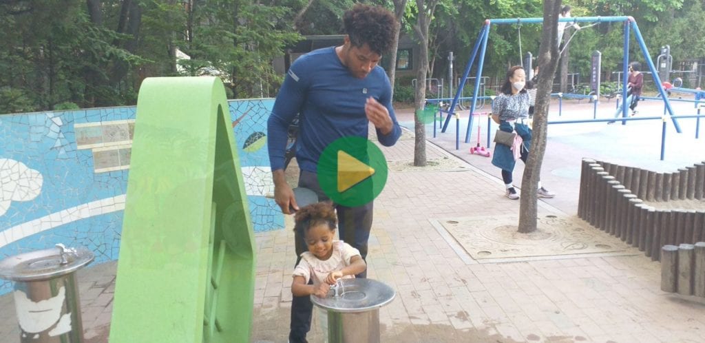 Multi-billionaire Kimroy Bailey and his adorable princess Keilah Trott Bailey drinking at the water fountain