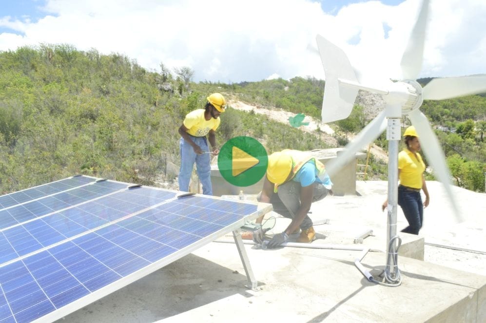 Multibillionaire Kimroy Bailey and a team of solar installers from the Kimroy Bailey Group of Companies