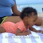 Baby Keilah Chilling on the Beach with Rasta Robot