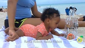 Baby Keilah Chilling on the Beach with Rasta Robot