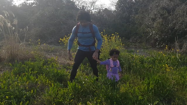 In the meadows picking flowers is Big King KB and Princess Keilah Lin Jeju South Korea