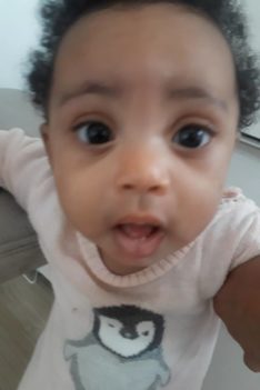 Princess Kaleeyon standing up and mommy holding her at about 9 months old. Diaries Of the world’s healthiest child.