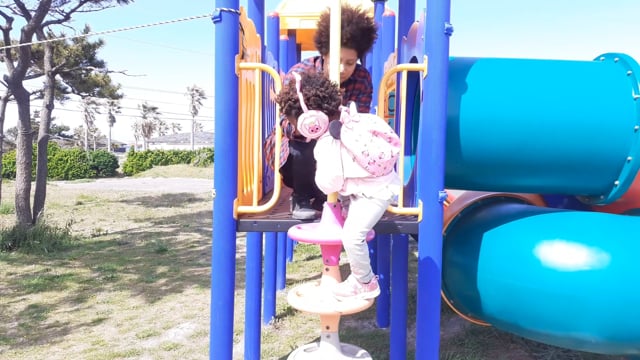 World Ruler Sher helping Princess Keilah on the Play park slide at Gimnyeong Beach Jeju
