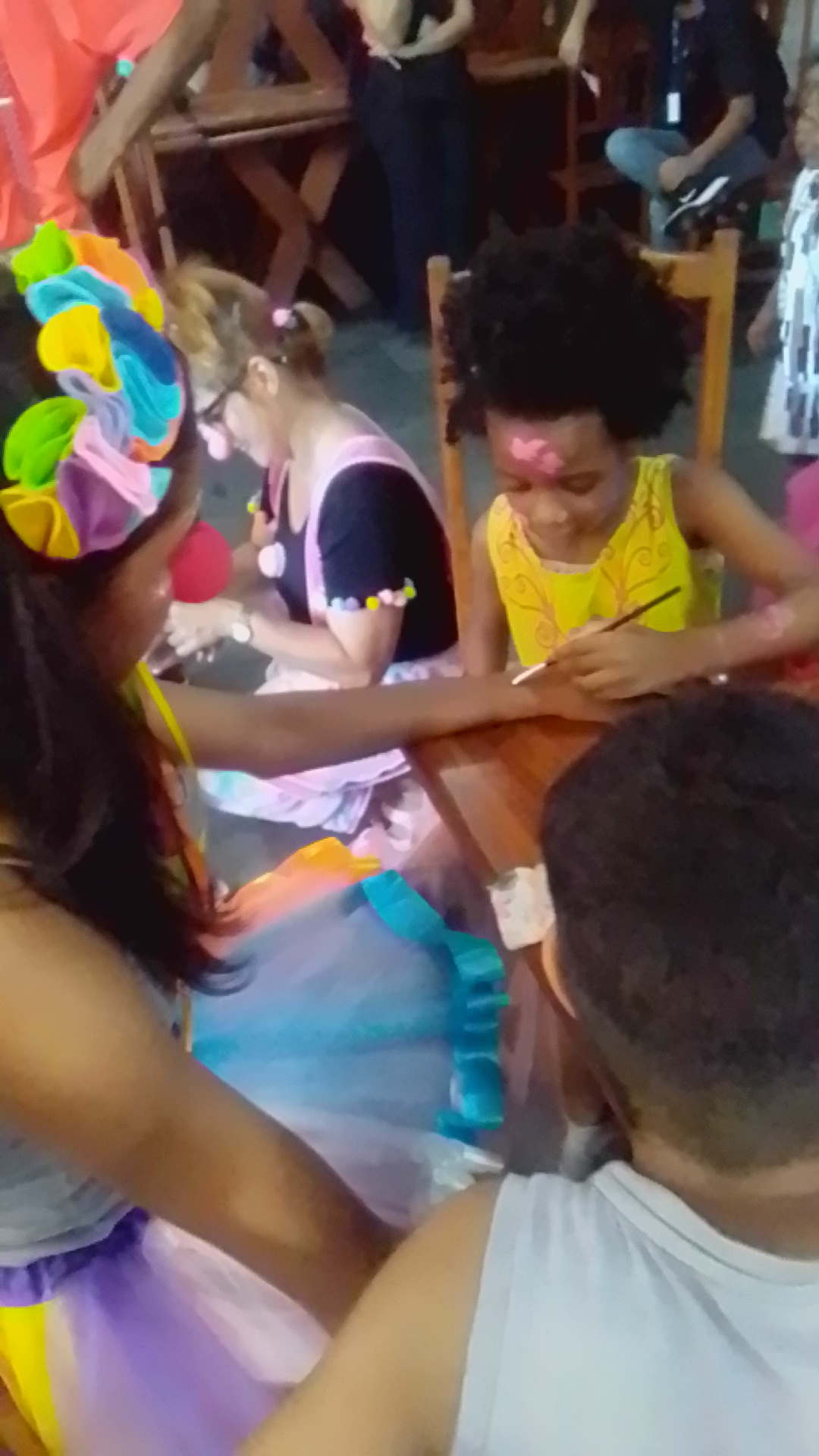 Princess Keilah Trott Bailey painting the clowns hand at kids party in Sao Paulo