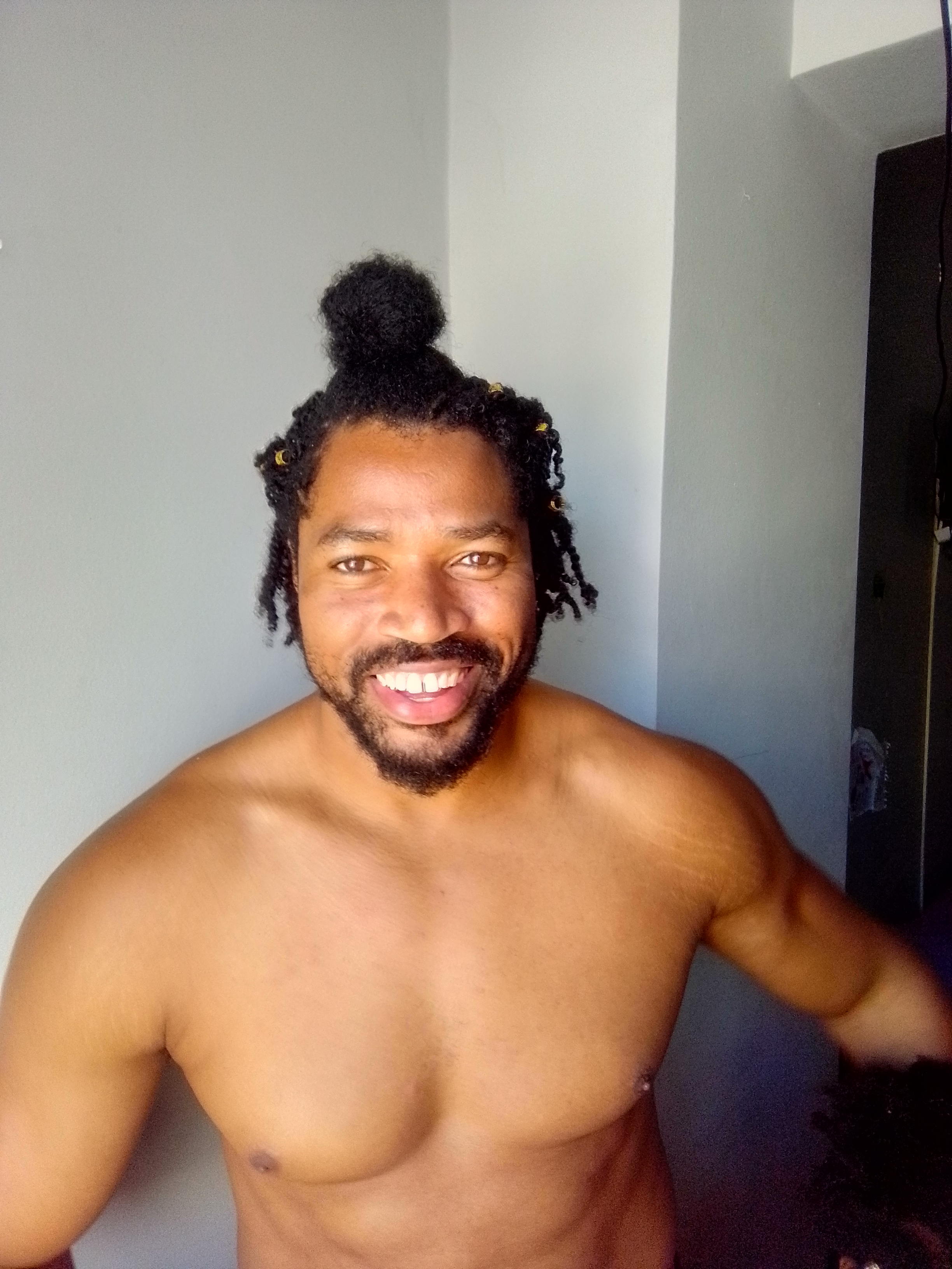 father counsel. Kimroy Bailey. Trott Bailey Family. World's most muscular naturally healthy man Kimroy Bailey Big King KB amazing photo with his natural long hair braided in an amazing style and tucked back with golden hair accessories.
