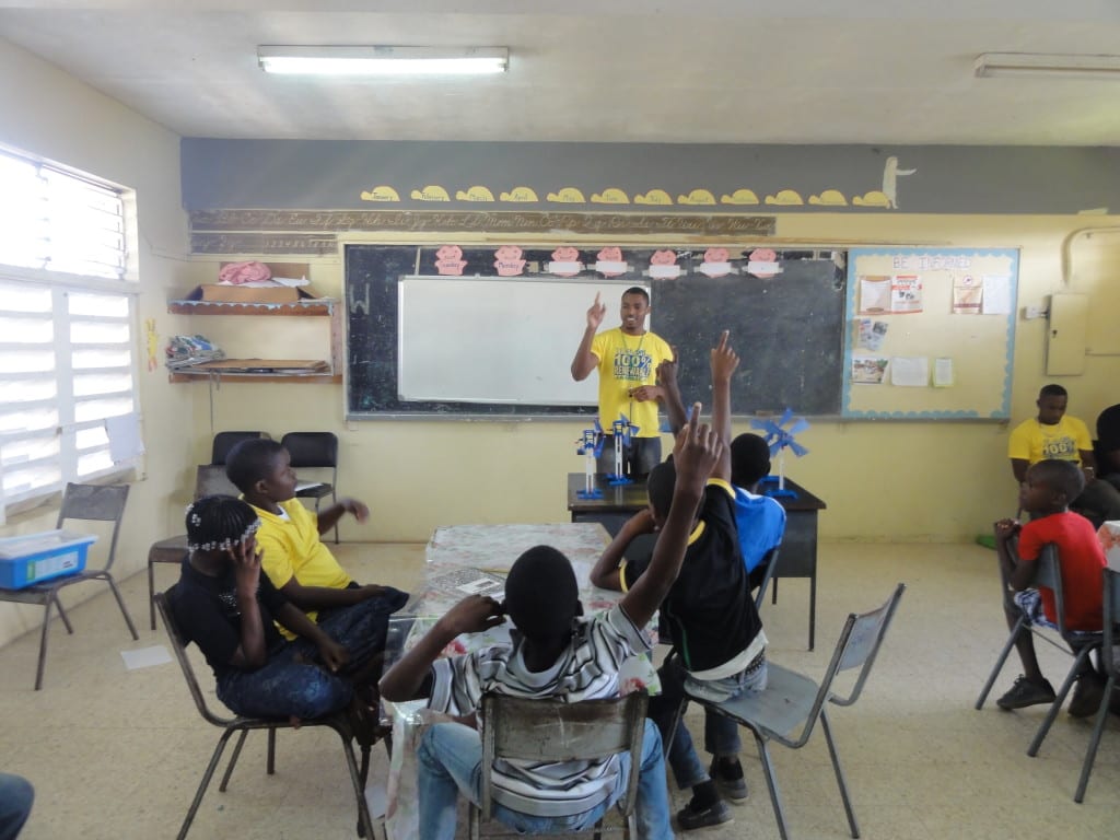 Kimroy Bailey with students from the lowe river primary school in trelawny jamaica after a robotics camp session using lego and kimroy bailey robotics kits