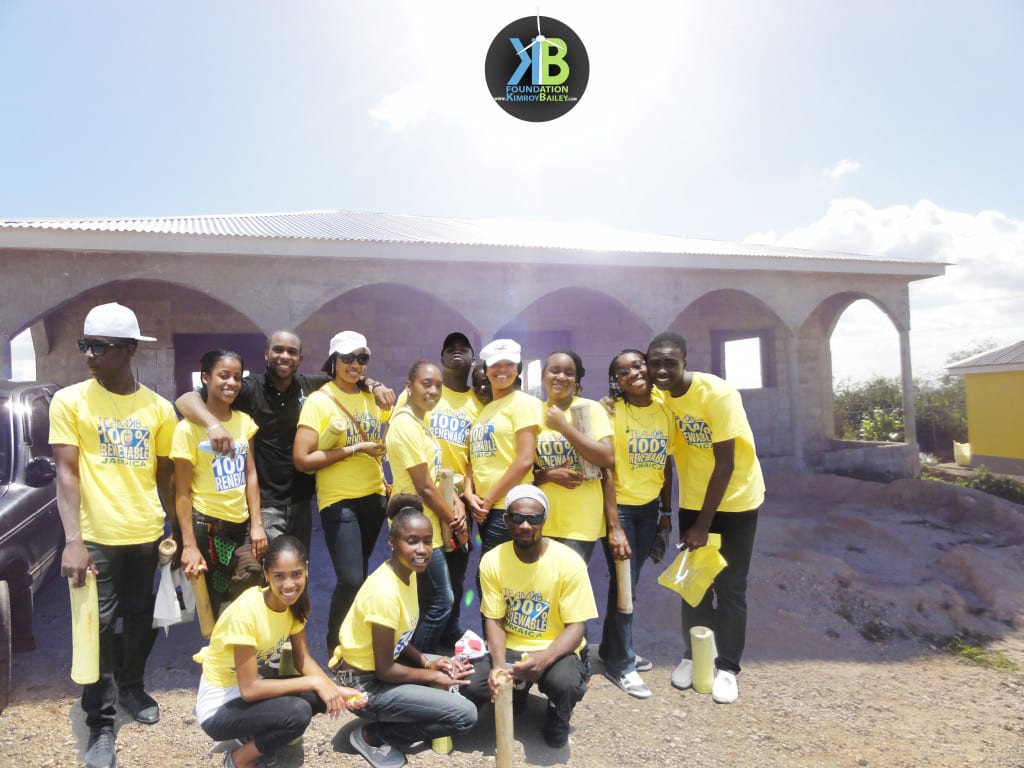 Volunteers from the Kimroy Bailey Foundation during Tag Drive 2013. Background: 100% RE Community Center in Trelawny