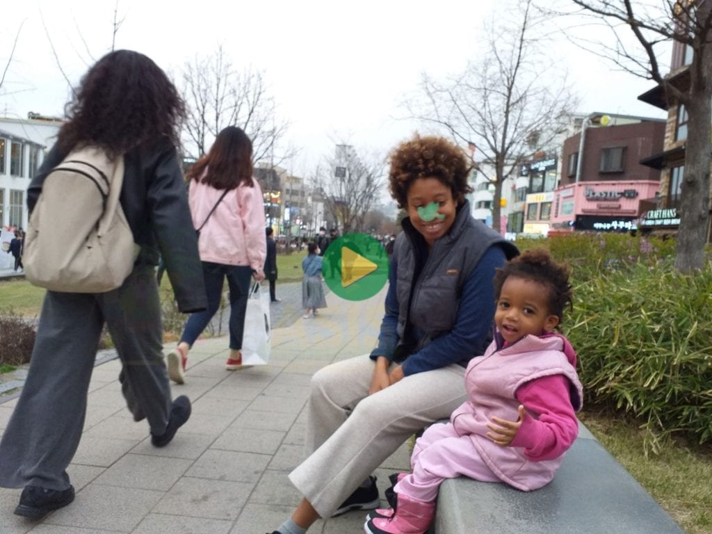 Trillionaire Sher Trott Bailey and Baby Keilah at the Trott Bailey University campus in South Korea