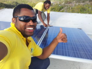 Tightening the panels unto the aluminium rail for the solar panel installation