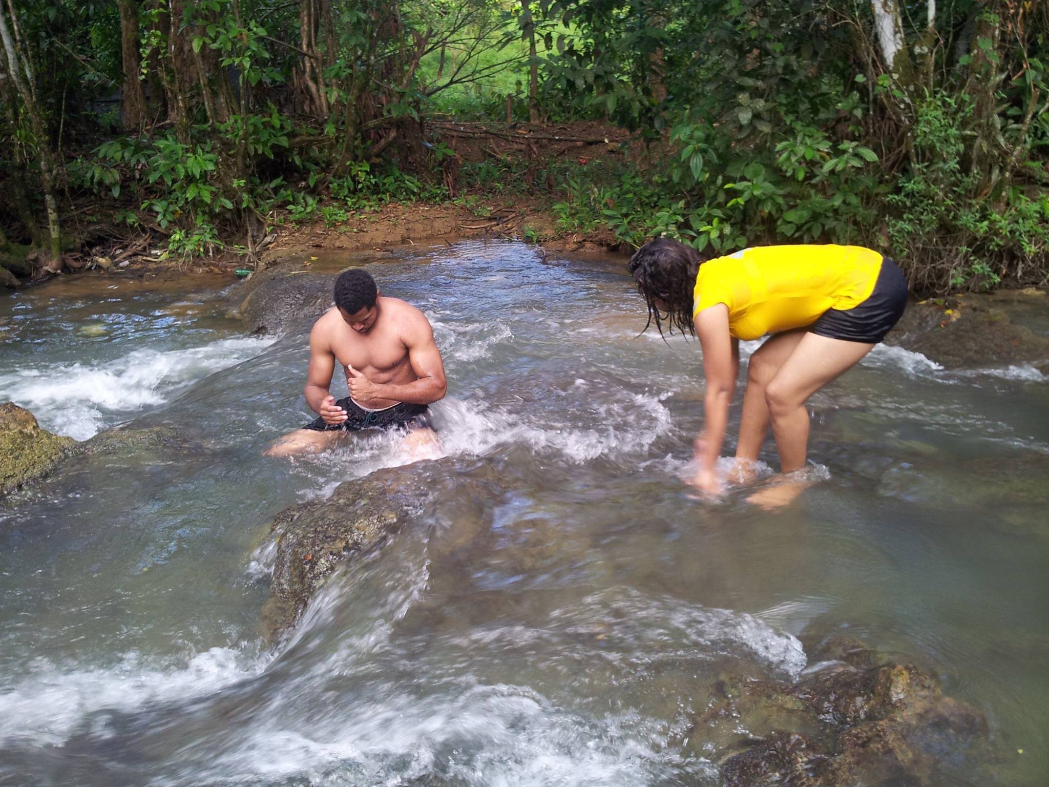 Kimroy Bailey and Sherika Trott Bailey at a river in Westmoreland Jamaica at the genisis of their astronomical wealth. While talking to God at this river over a decade ago God told the Trott Bailey that they will become the richest family on earth