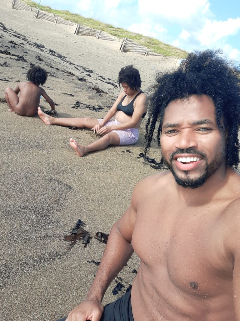 Quadrillionaire Trott Bailey Family chilling at the beach. Buff Bodybuilder Kimroy KB Bailey, Food lover Sher Trott Bailey and Princess Keilah Trott Bailey